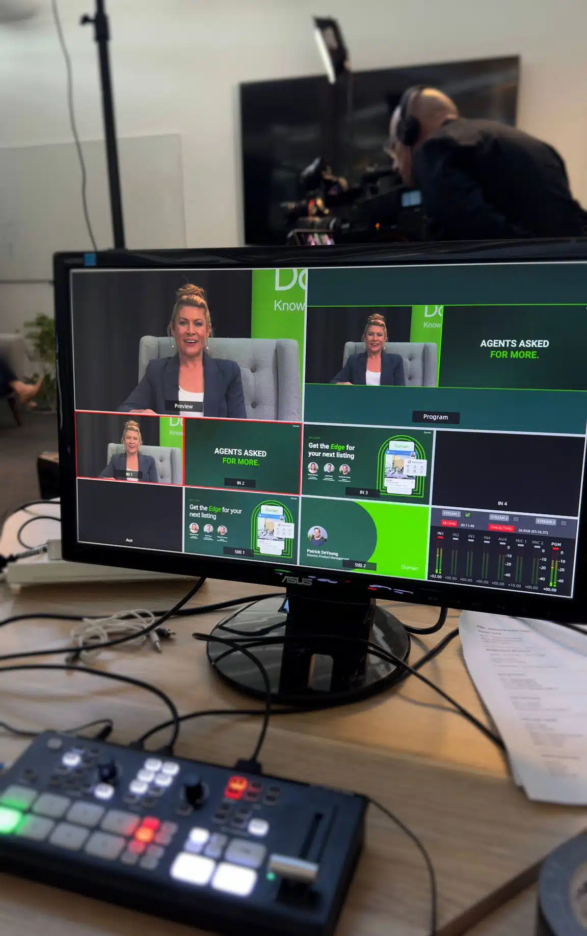 Live switched corporate webinar production setup with multi-camera monitoring, presentation slides and Zoom webinar integration for a Domain webinar.